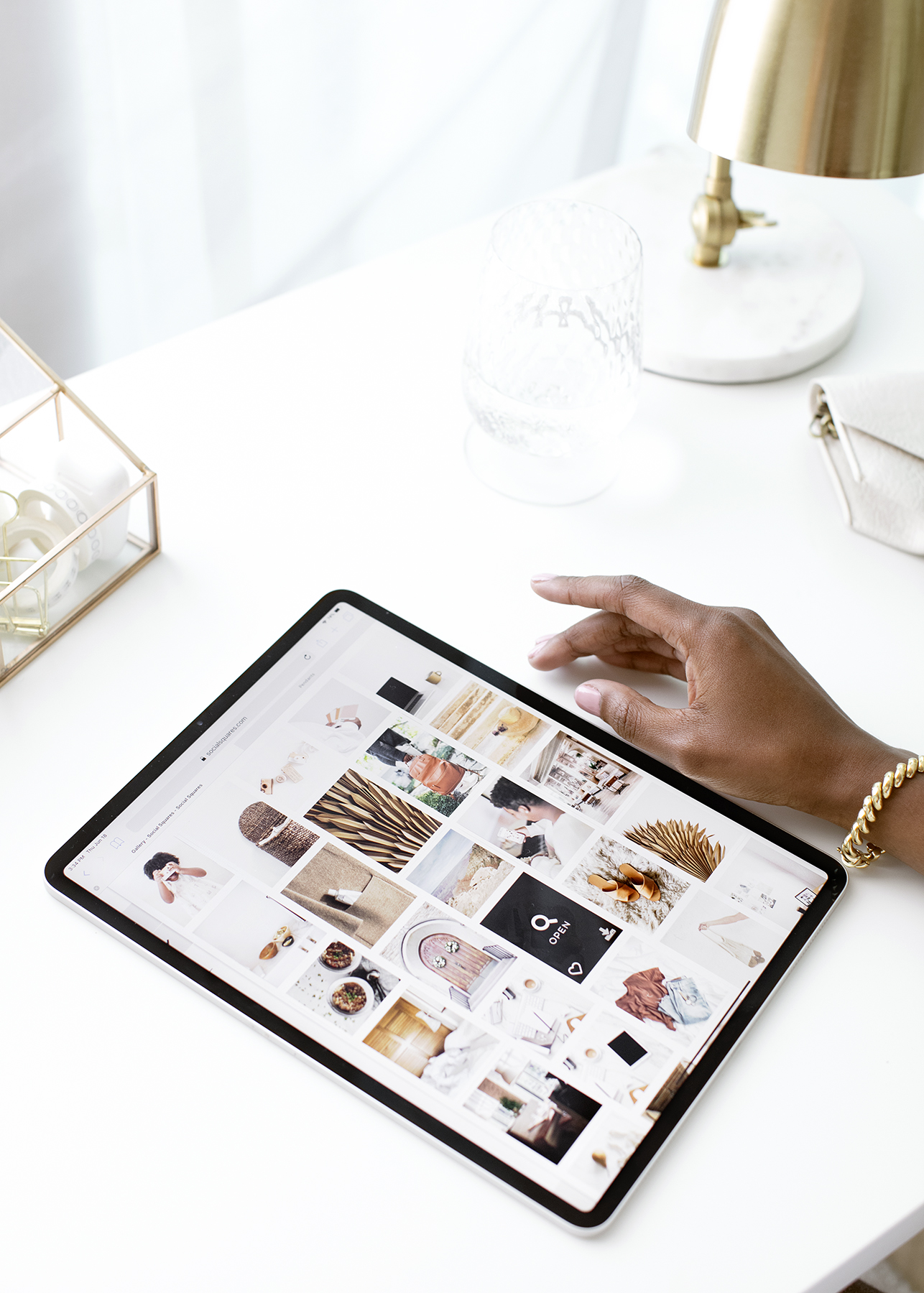 A woman looking at products on an ipad to compliment a blog post about writing memorable product names and compelling product descriptions